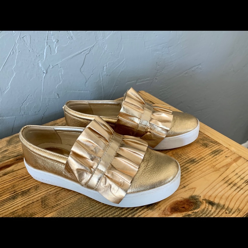 Gold MK shoes.